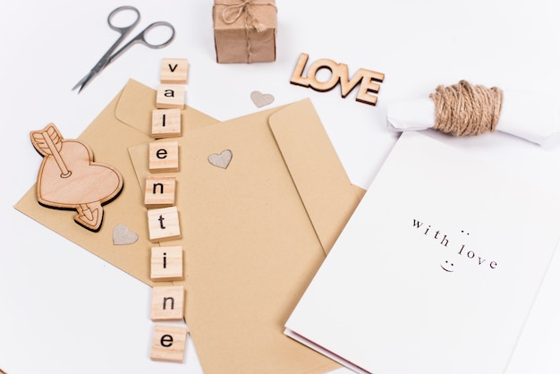 Free photo valentine inscription with envelopes on table