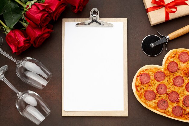 Valentine's day composition with empty clipboard
