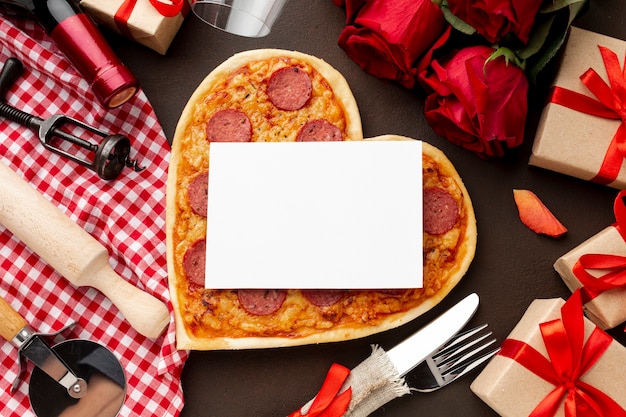 Valentines day assortment with pizza and white card