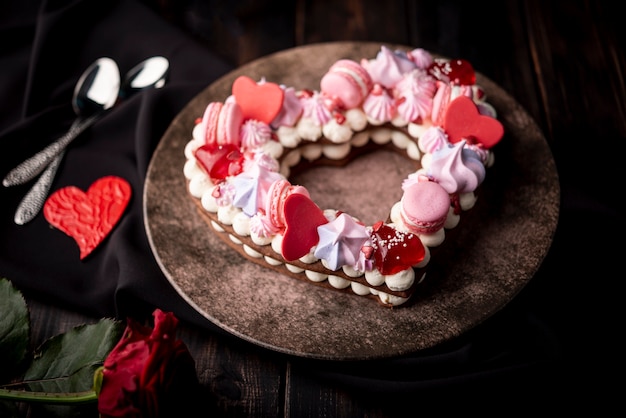 Valentines day cake on plate with hearts and rose