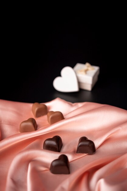 Valentines day chocolates on satin with copy space