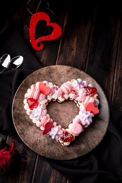 Valentines day heart-shaped cake with macarons