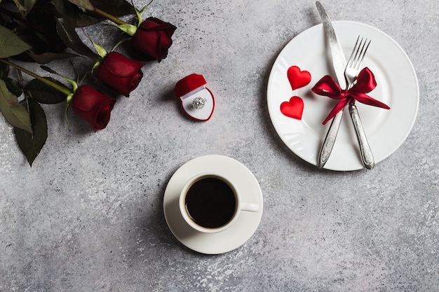 Free photo valentines day romantic dinner table setting marry me wedding engagement ring