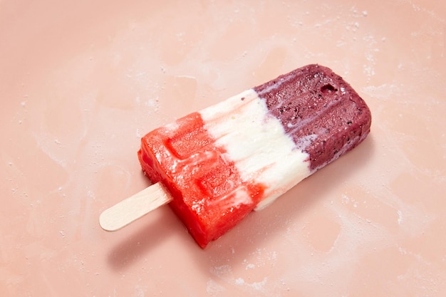 Vanilla berry organic homemade lollipop ice presented on a pink background with copy space for text Natural healthy food Top view