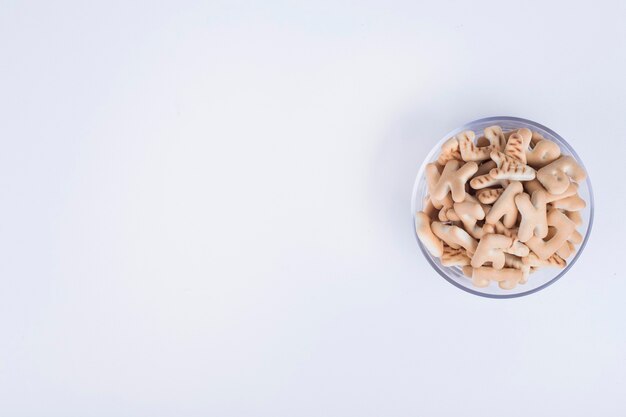 Vanilla crackers in letter shape in a glass cup