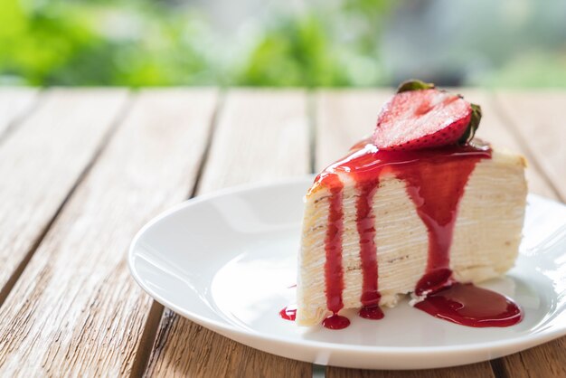 vanilla crape cake with strawberry sauce