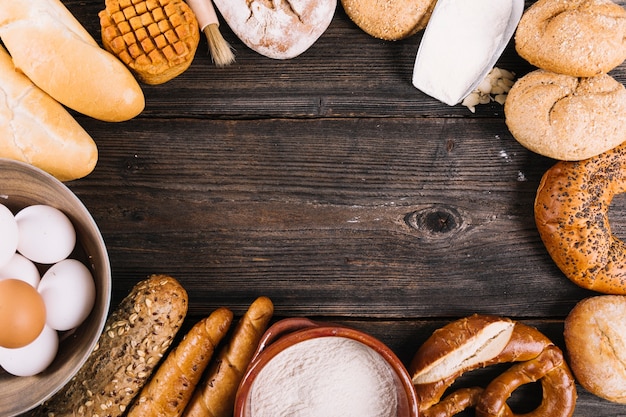 Variety of baked breads on table with space for text