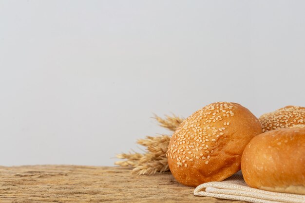 Variety of bread on wooden table on an old wooden background.