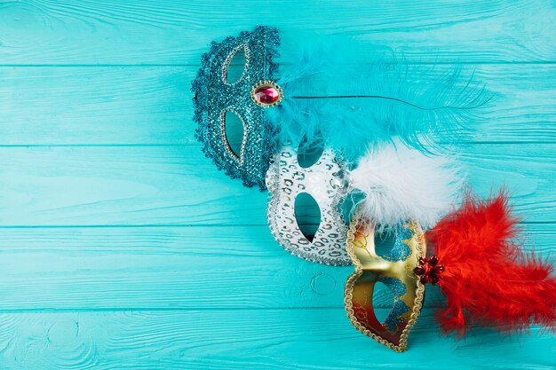 Variety of colorful masquerade carnival mask with feather on table