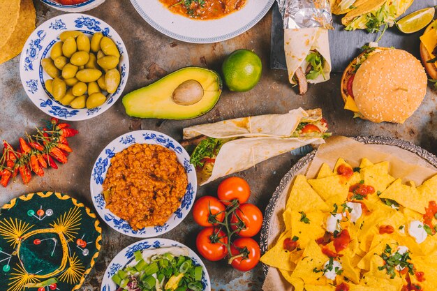 Variety of colorful mexican cuisine breakfast dishes rustic background