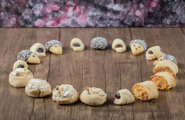 Variety of cookies standing on wooden.