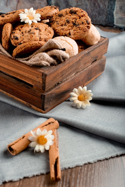 Variety of cookies in a wooden tray