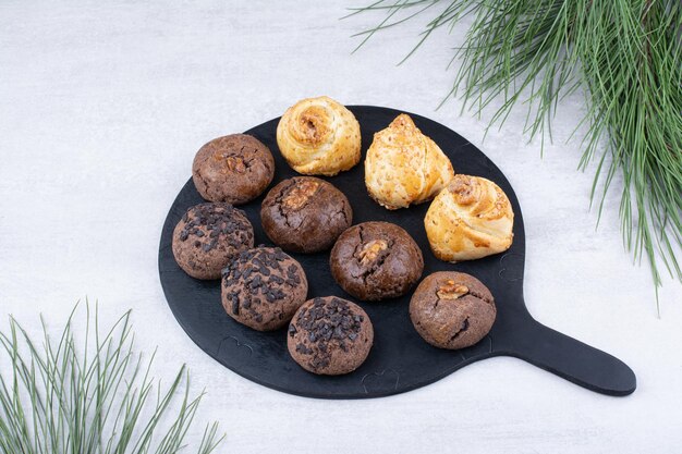 Variety of delicious cookies on black board. High quality photo