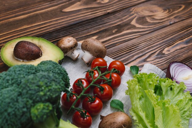 Variety of fresh vegetables on wooden desk