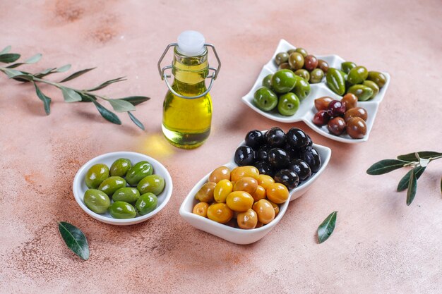 Variety of green and black whole olives.