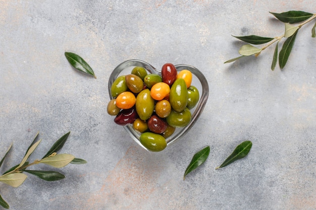 Variety of green and black whole olives.