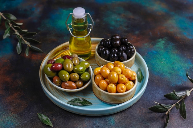 Variety of green and black whole olives.