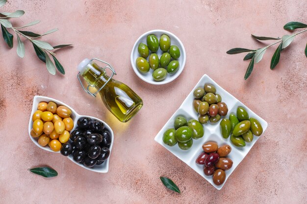 Variety of green and black whole olives.