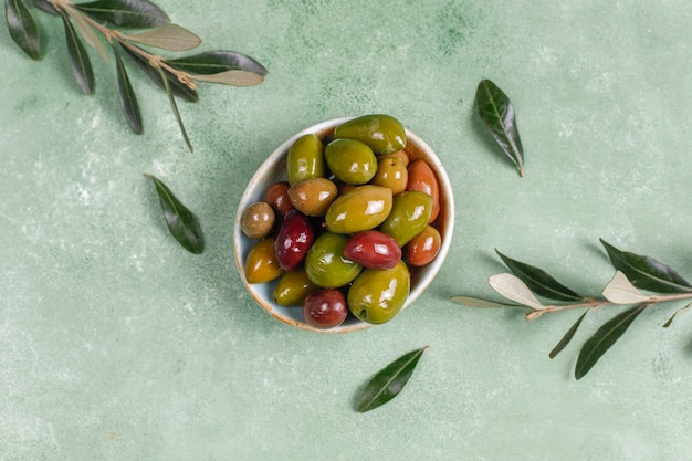 Variety of green and black whole olives.