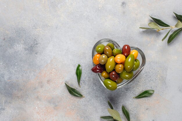 Variety of green and black whole olives.