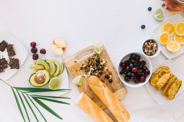 Variety of healthy fresh breakfast on white backdrop