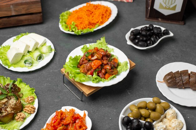 Variety of marinated foods on the table with traditional turshu govurma.