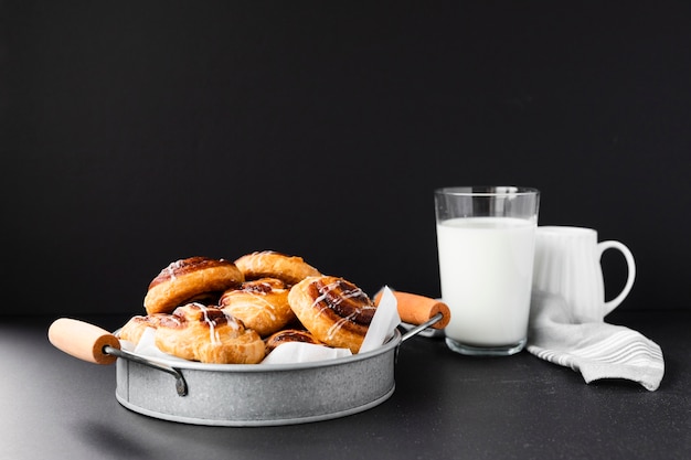 Variety of pain aux raisins with milk