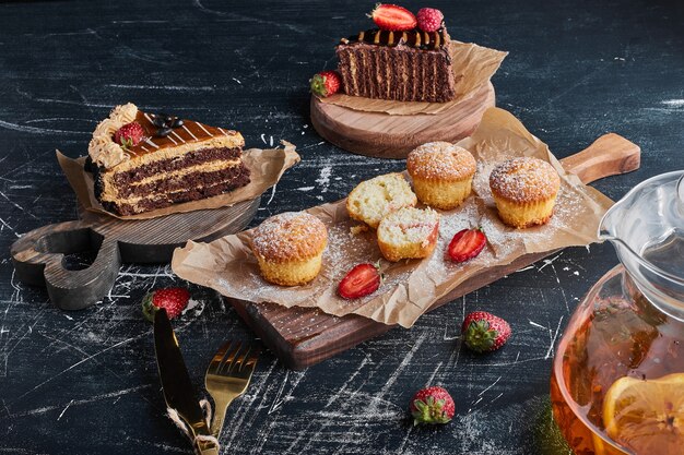 Variety of pastries on wooden boards. 