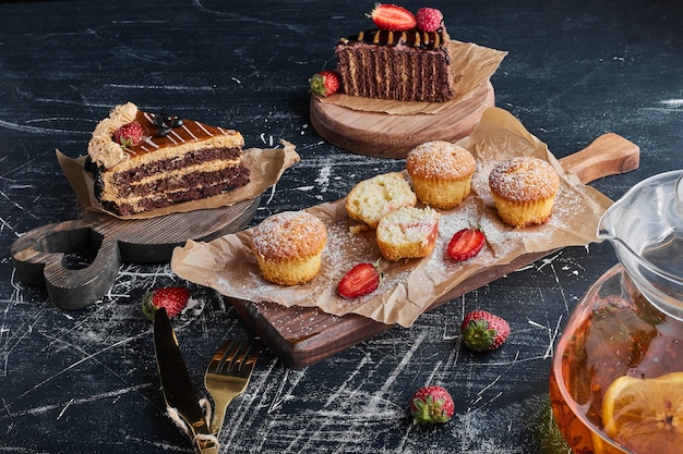 Variety of pastries on wooden boards. 