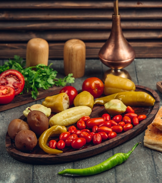 Free photo variety of pickles on wooden dishes