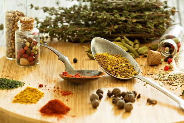 Variety of spices and herb on a wooden board