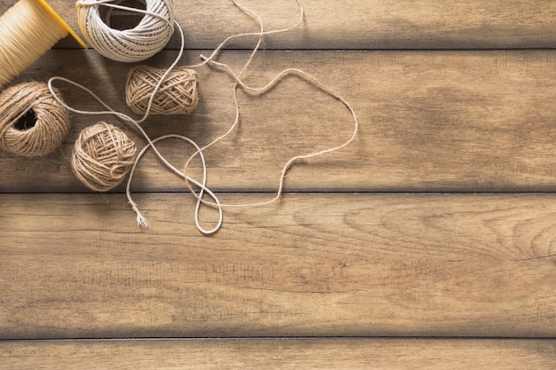 Variety of string spool on wooden table