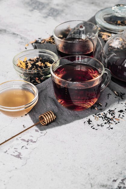 Variety of tea cups and herbs high view