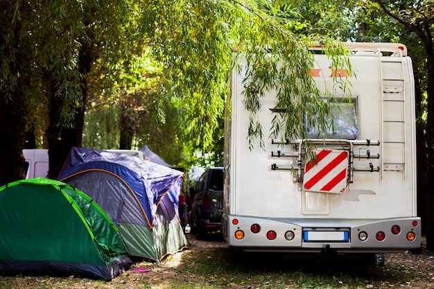 variety of tents and van for camping