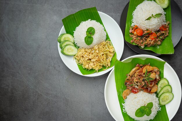 Variety thai food put on banana leaf