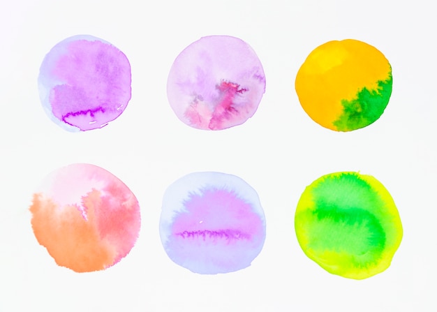 Variety of watercolor circles on white background