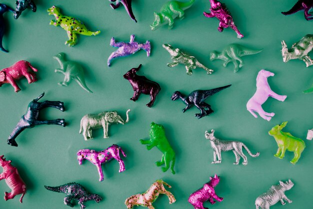 Various animal toy figures in a colorful background