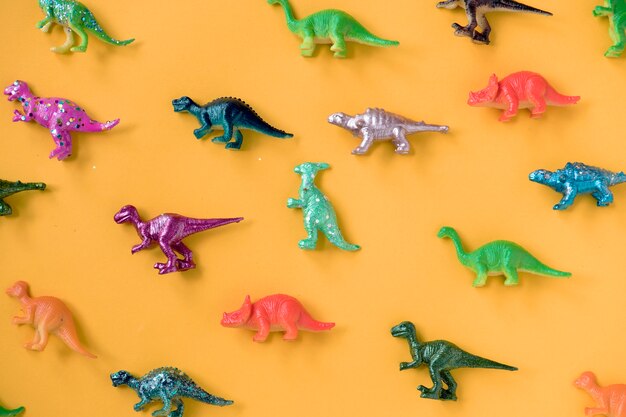 Various animal toy figures in a colorful background