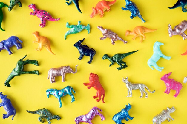 Various animal toy figures in a colorful background