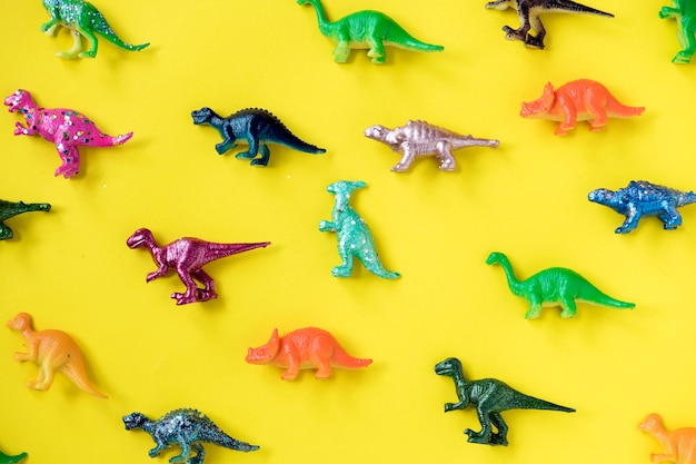 Various animal toy figures in a colorful background