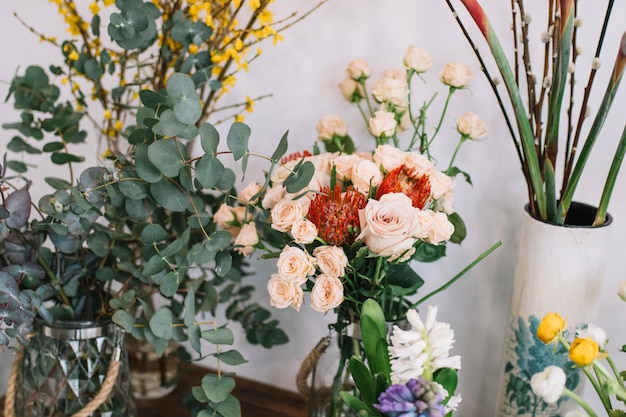 Various blooming flowers in vases