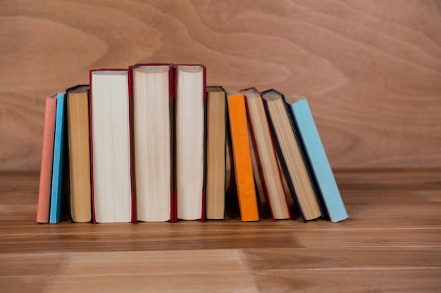 Free photo various book on a wooden table