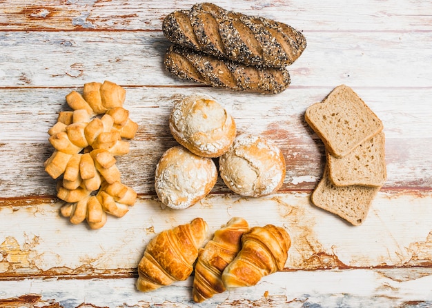 Various buns and bread on table