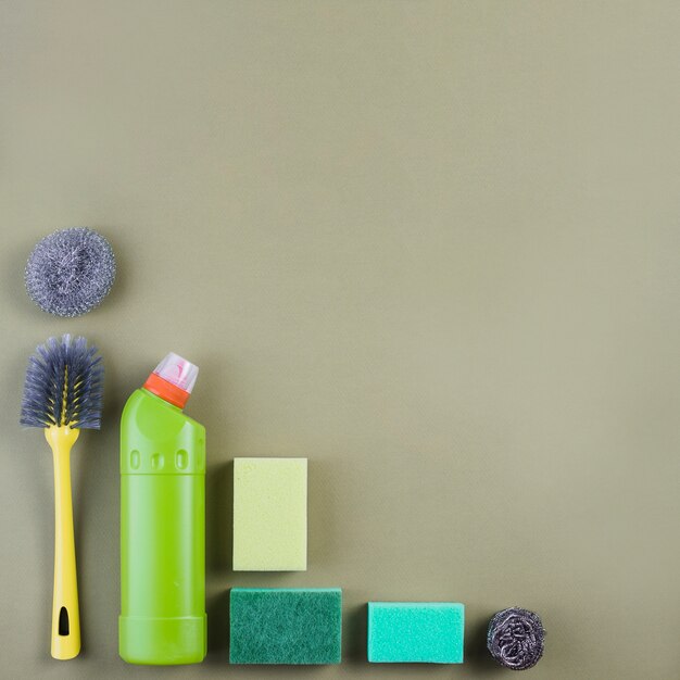 Various cleaning equipment on colored backdrop