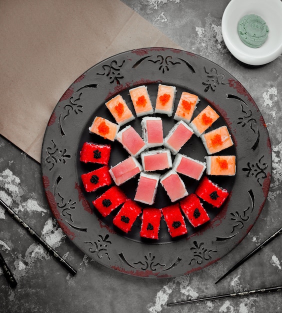 Free photo various colored sushi set top view