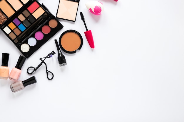 Free photo various cosmetics scattered on table