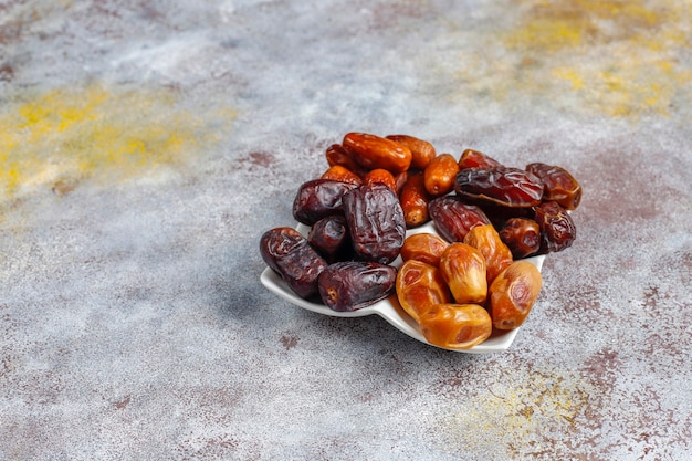 Free photo various of dried dates or kurma.