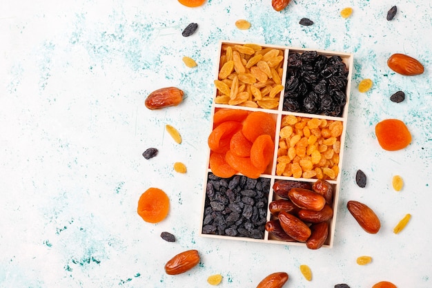 Various dried fruits, dates, plums, raisins, figs, top view