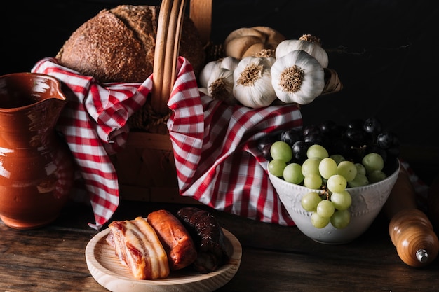 Various food and jug near basket