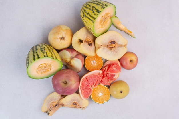 Various fresh fruits on white table.